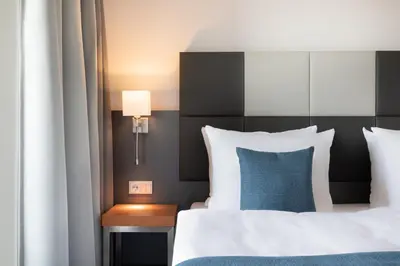 Ein Bett oder Betten in einem Zimmer der Unterkunft Garner Hotel Rüsselsheim by IHG