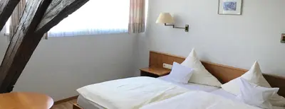 Ein Bett oder Betten in einem Zimmer der Unterkunft Gasthof Anker
