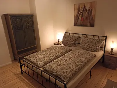 Ein Bett oder Betten in einem Zimmer der Unterkunft Alte Schmiede Neustadt
