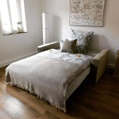 Ein Bett oder Betten in einem Zimmer der Unterkunft Alte Schmiede Neustadt