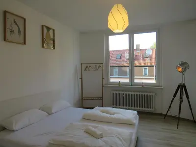 Ein Bett oder Betten in einem Zimmer der Unterkunft L8 Street Monteurwohnung - Kaiser-Friedrich-Str