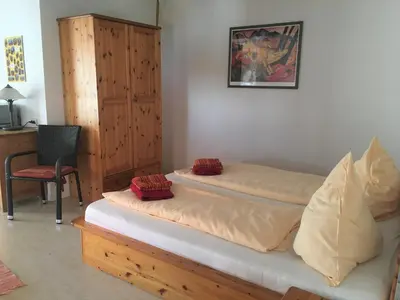 Ein Bett oder Betten in einem Zimmer der Unterkunft Lautersheimer Gutshof