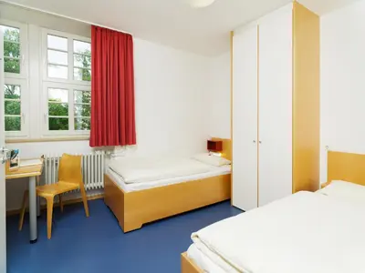Ein Bett oder Betten in einem Zimmer der Unterkunft Bildungshaus Neckarelz