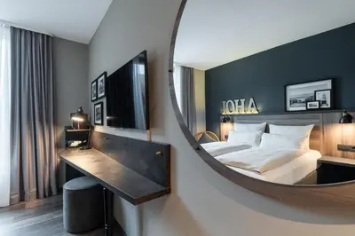 Ein Bett oder Betten in einem Zimmer der Unterkunft HARBR Hotel Ludwigsburg, a member of Radisson Individuals