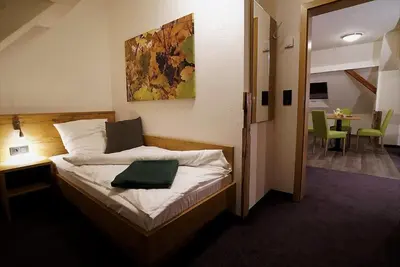 Ein Bett oder Betten in einem Zimmer der Unterkunft Kelterhotel Fröscher