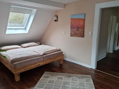 Ein Bett oder Betten in einem Zimmer der Unterkunft Ferienwohnung Sägemühle