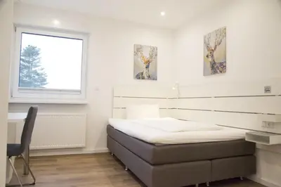 Ein Bett oder Betten in einem Zimmer der Unterkunft Main Motel
