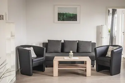 Ein Sitzbereich in der Unterkunft Pension Nickel Ferienwohnung I Waldstraße 18 Alsbach-Hähnlein