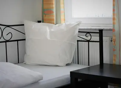 Ein Bett oder Betten in einem Zimmer der Unterkunft Herrenhof 12