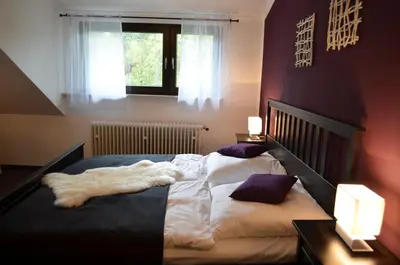 Ein Bett oder Betten in einem Zimmer der Unterkunft Wolfschlucht