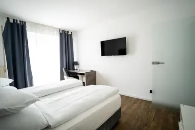 Ein Bett oder Betten in einem Zimmer der Unterkunft AP Hotel Mannheim Viernheim