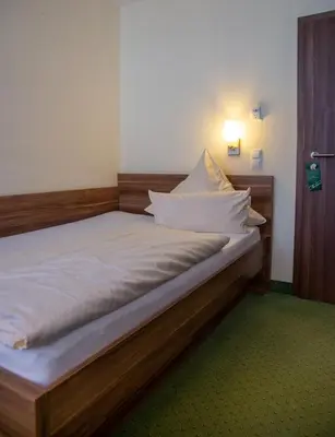 Ein Bett oder Betten in einem Zimmer der Unterkunft Wertheimer Stuben