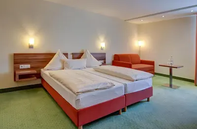 Ein Bett oder Betten in einem Zimmer der Unterkunft Wertheimer Stuben