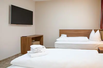 Ein Bett oder Betten in einem Zimmer der Unterkunft Work & Sleep Boardinghouse Mannheim