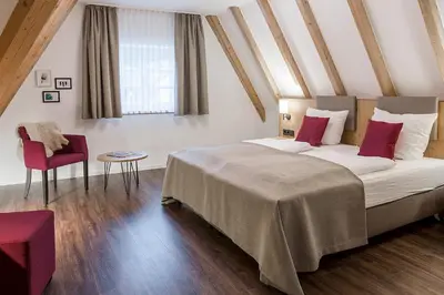 Ein Bett oder Betten in einem Zimmer der Unterkunft Hotel & Restaurant Lamm