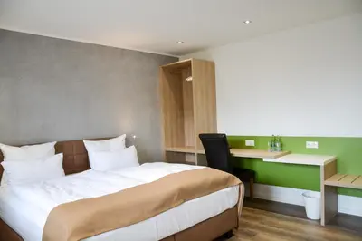 Ein Bett oder Betten in einem Zimmer der Unterkunft Hotel-Restaurant Kölbl