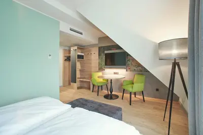Ein Bett oder Betten in einem Zimmer der Unterkunft Hotel Bad Dürkheim