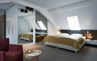 Ein Bett oder Betten in einem Zimmer der Unterkunft Weinhaus Henninger