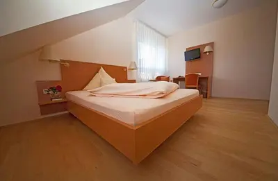 Ein Bett oder Betten in einem Zimmer der Unterkunft Hotel & Restaurant Krone