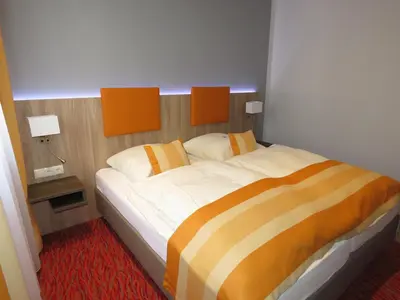 Ein Bett oder Betten in einem Zimmer der Unterkunft Hotel Trutzpfaff