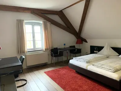 Ein Bett oder Betten in einem Zimmer der Unterkunft Buhlsche Mühle