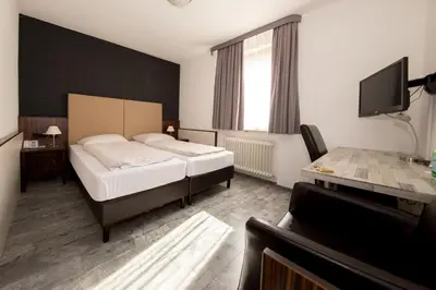Ein Bett oder Betten in einem Zimmer der Unterkunft Hotel Krone