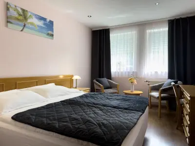 Ein Bett oder Betten in einem Zimmer der Unterkunft Hotel DenRiKo