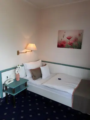 Ein Bett oder Betten in einem Zimmer der Unterkunft PANORAMA Hotel Heimbuchenthal