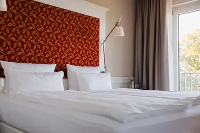 Ein Bett oder Betten in einem Zimmer der Unterkunft Berggasthof Königstuhl