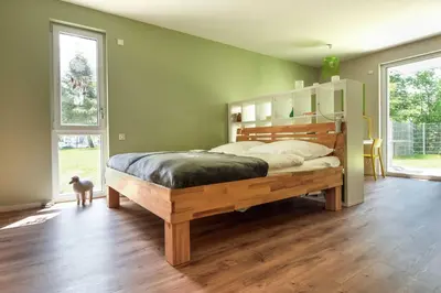 Ein Bett oder Betten in einem Zimmer der Unterkunft Sonnenscheinhaus Wohnung 3