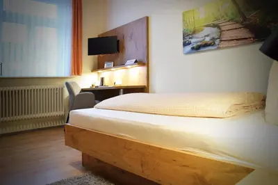 Ein Bett oder Betten in einem Zimmer der Unterkunft Gasthof zur Krone