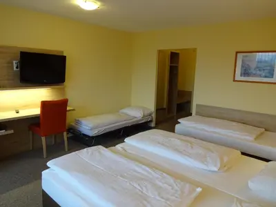 Ein Bett oder Betten in einem Zimmer der Unterkunft Gasthof Hotel Zum Ross