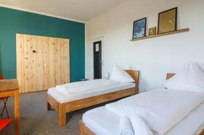 Ein Bett oder Betten in einem Zimmer der Unterkunft Private Rooms Karlsruhe near station
