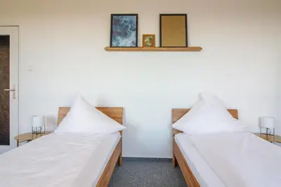 Ein Bett oder Betten in einem Zimmer der Unterkunft Private Rooms Karlsruhe near station