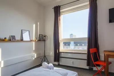 Ein Bett oder Betten in einem Zimmer der Unterkunft Private Rooms Karlsruhe near station