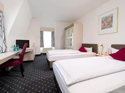 Ein Bett oder Betten in einem Zimmer der Unterkunft ACHAT Hotel Reilingen Walldorf