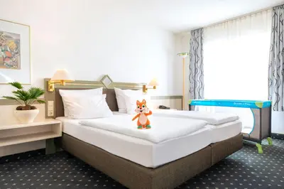 Ein Bett oder Betten in einem Zimmer der Unterkunft ACHAT Hotel Reilingen Walldorf