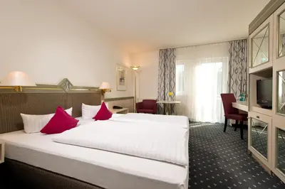 Ein Bett oder Betten in einem Zimmer der Unterkunft ACHAT Hotel Reilingen Walldorf