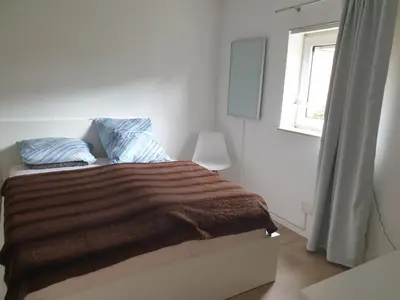 Ein Bett oder Betten in einem Zimmer der Unterkunft Am Schloss