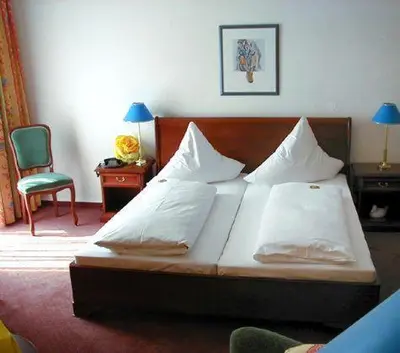 Ein Bett oder Betten in einem Zimmer der Unterkunft Regina