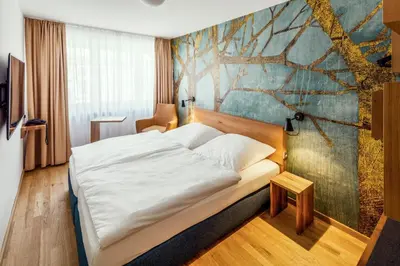 Ein Bett oder Betten in einem Zimmer der Unterkunft Hotel Restaurant Goldener Engel