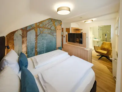 Ein Bett oder Betten in einem Zimmer der Unterkunft Hotel Restaurant Goldener Engel