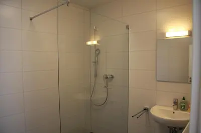 Ein Badezimmer in der Unterkunft C+U Ferienwohnungen
