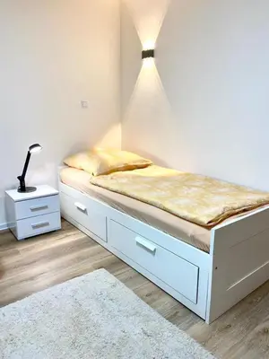 Ein Bett oder Betten in einem Zimmer der Unterkunft Wohnung im Erdgeschoss