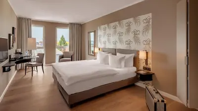 Ein Bett oder Betten in einem Zimmer der Unterkunft Hotel Villa Toskana
