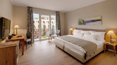 Ein Bett oder Betten in einem Zimmer der Unterkunft Hotel Villa Toskana