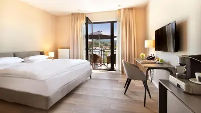 Ein Bett oder Betten in einem Zimmer der Unterkunft Hotel Villa Toskana
