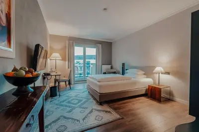 Ein Bett oder Betten in einem Zimmer der Unterkunft Hotel Villa Toskana