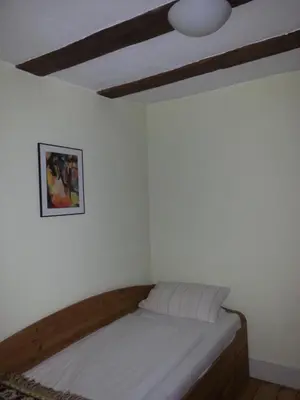 Ein Bett oder Betten in einem Zimmer der Unterkunft Hotel Blaues Haus