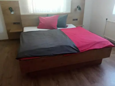 Ein Bett oder Betten in einem Zimmer der Unterkunft Gasthof Zum Löwen